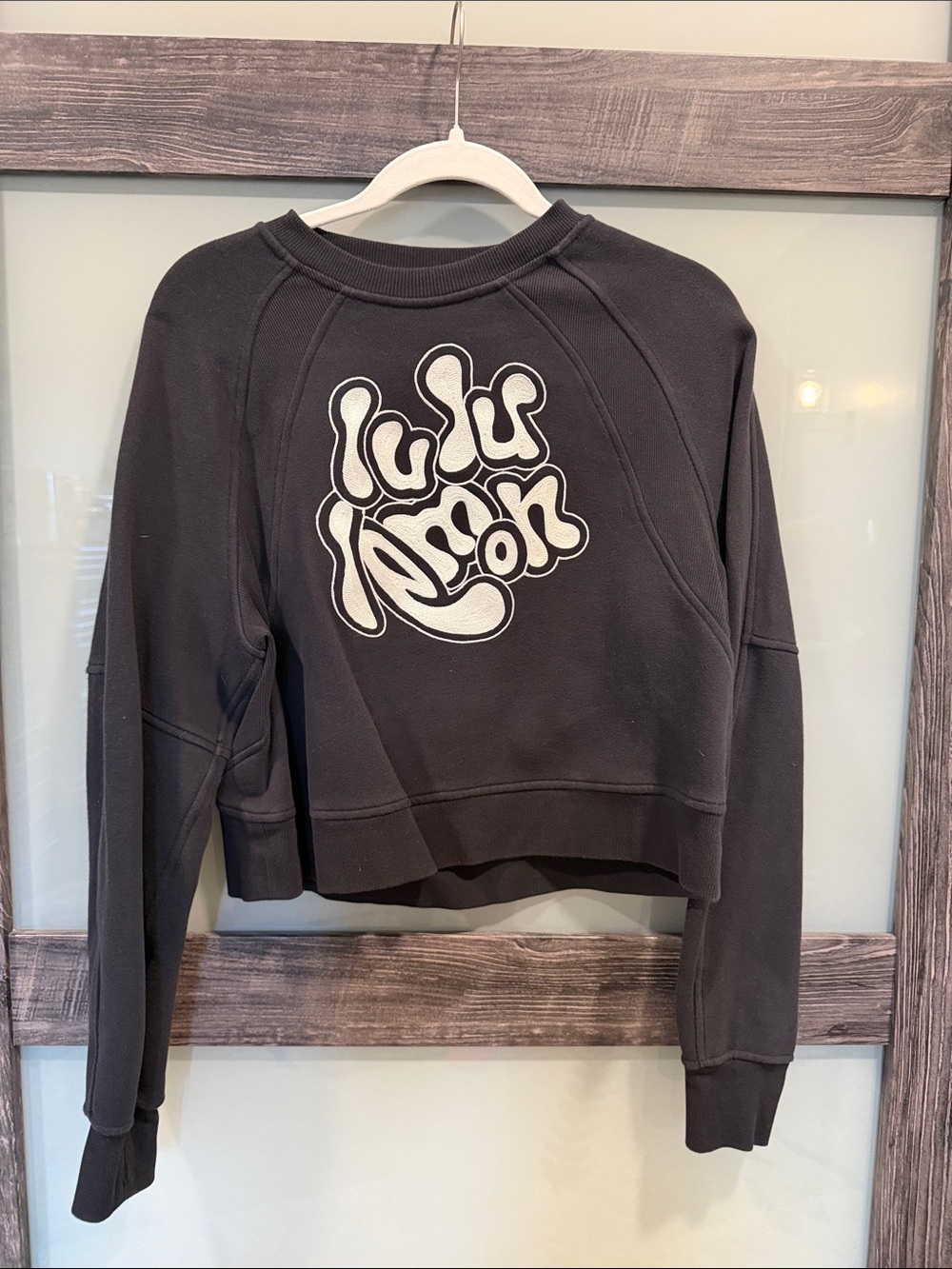 lululemon athletica black cropped sweatshirt with white graphic